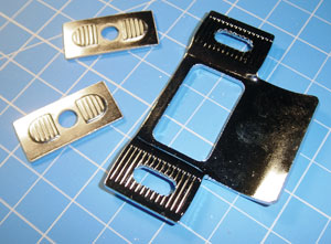 Figure 1. Two-piece strike plates when out of adjustment will damage dead-latch assemblies.