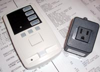 Freedom F-TP touchpad shown with unique Freedom current sensor for garage door applications.