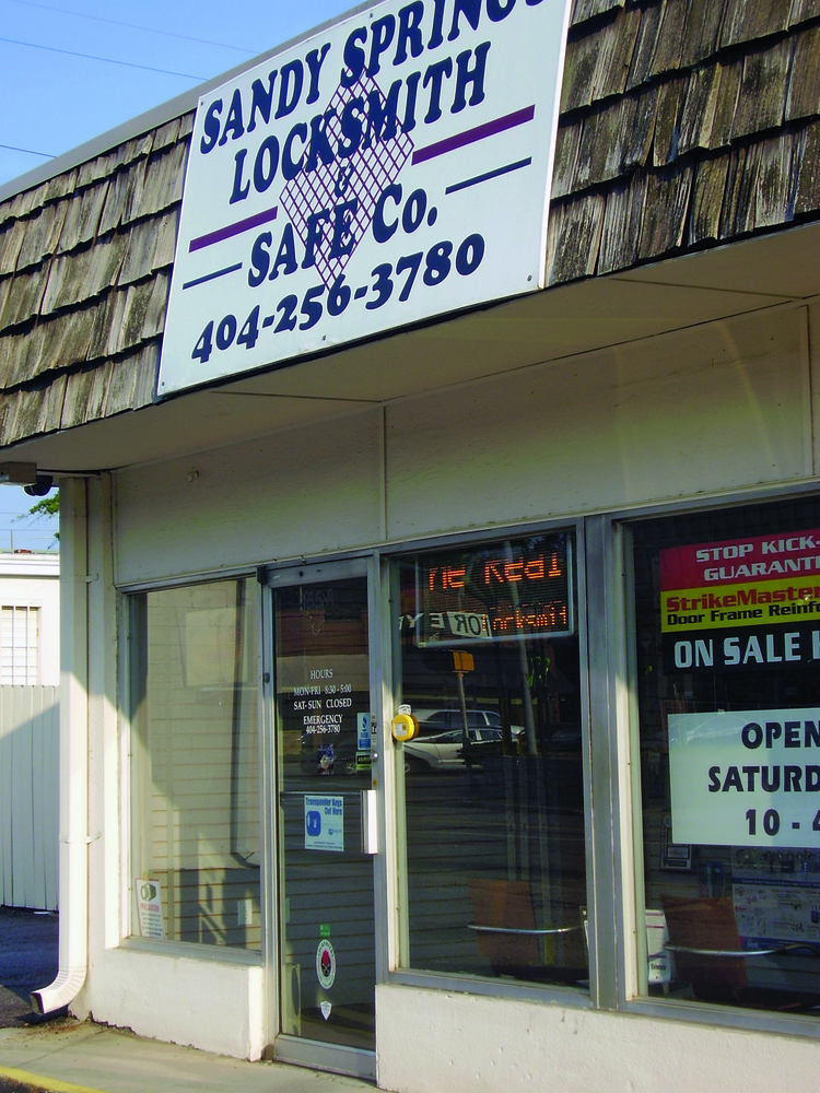 This suburban Atlanta lock shop posts advertised specials in the front window