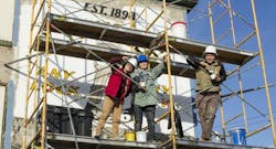 Tyler School of Art students Olivia Menta and Stacy Holder worked with Mural Arts restoration crew leader Nathaniel Lee to help restore the faded sign for the Hessler Locksmith Company Tyler School of Art students Olivia Menta and Stacy Holder worked with Mural Arts restoration crew leader Nathaniel Lee to help restore the faded sign for the Hessler Locksmith Company