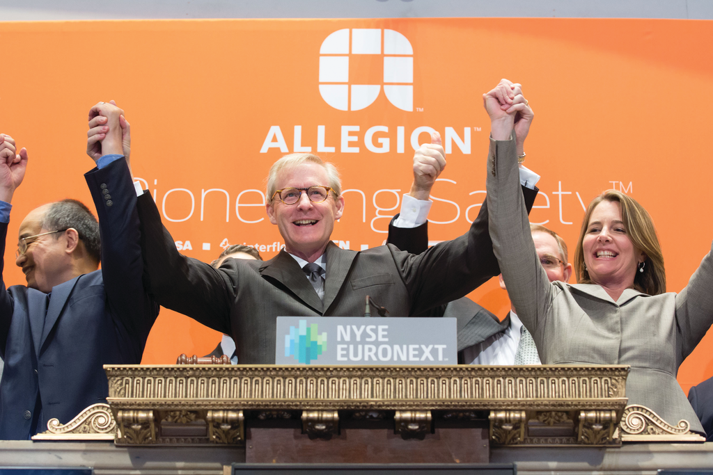 Dave Petratis (center) and other Allegion executies celebrate the ringing of the opening bell at the NYSE.