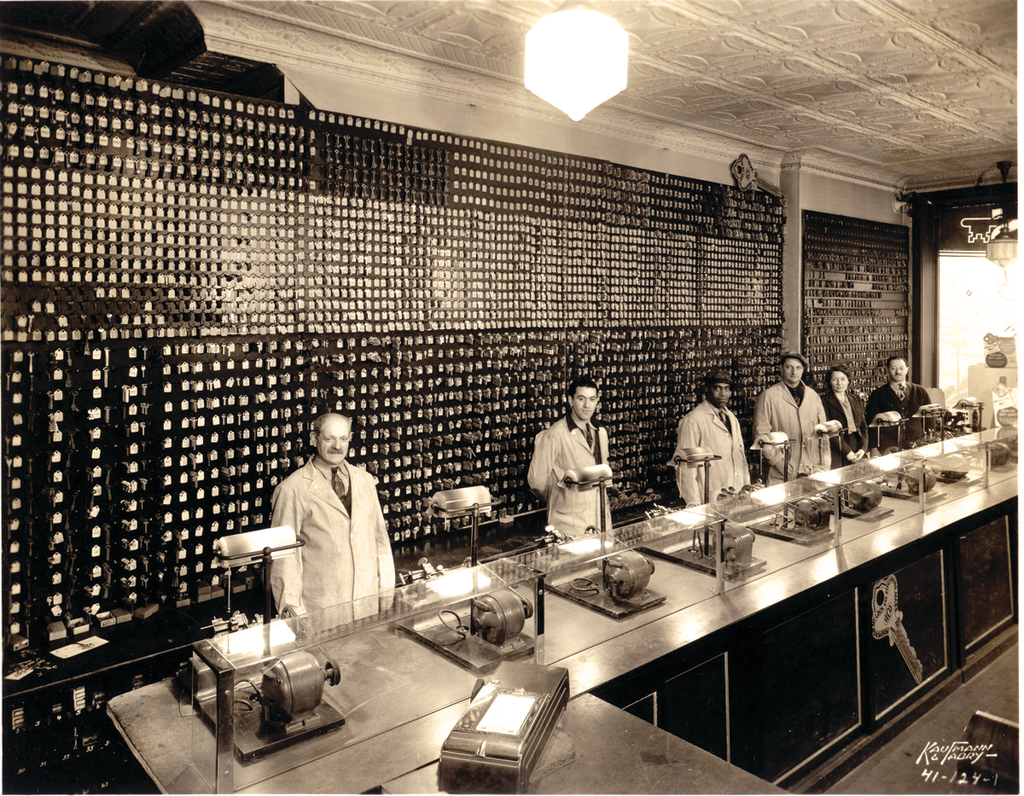Locksmiths cut keys in front of the massive keyboard