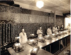 Locksmiths cut keys in front of the massive keyboard Locksmiths cut keys in front of the massive keyboard