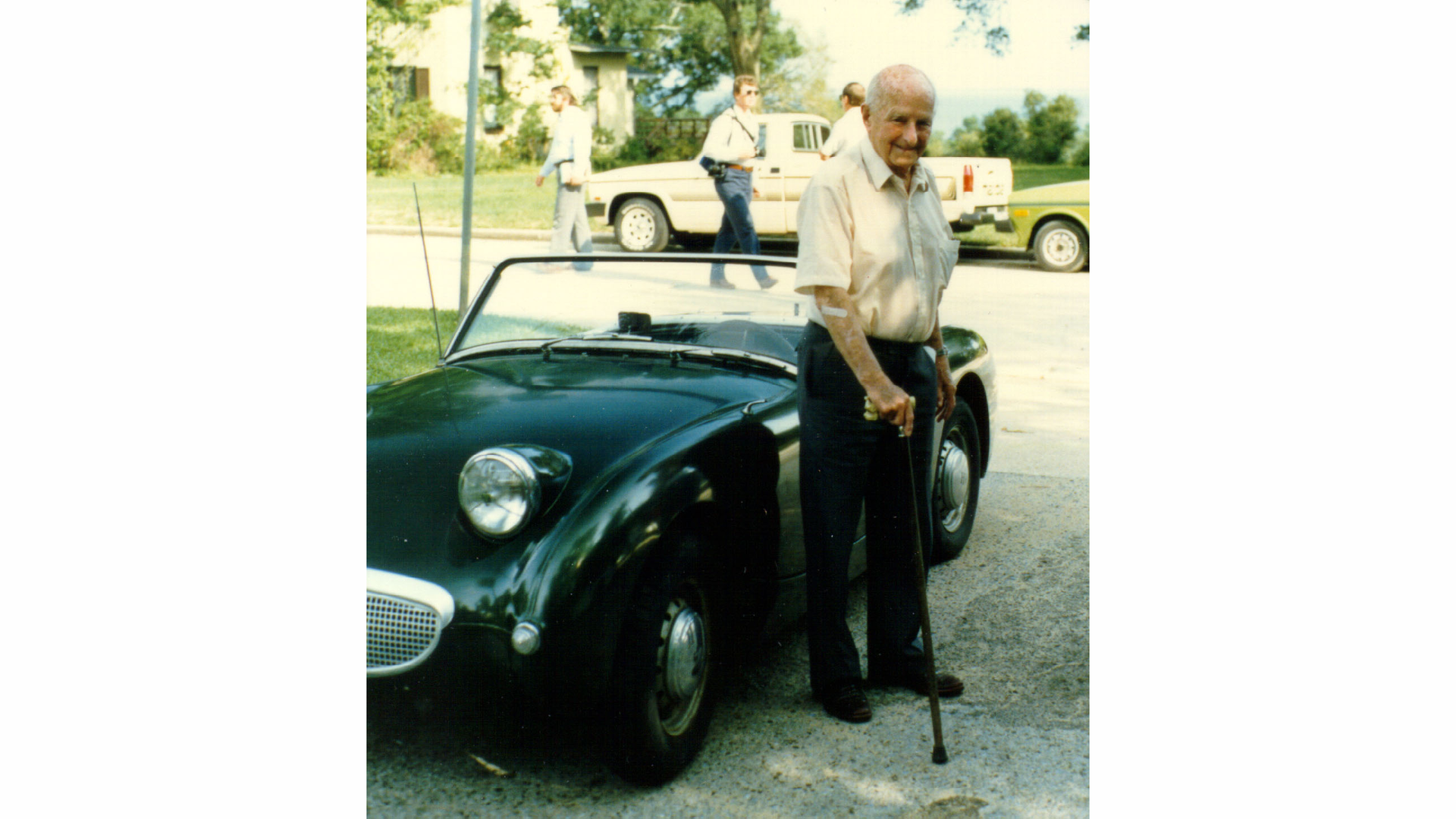 Photo 1: Donald Healey, legendary designer of the Austin Healey line, standing next to Steve Young&rsquo;s 1959 Austin Healey Sprite, which does not have locking doors.