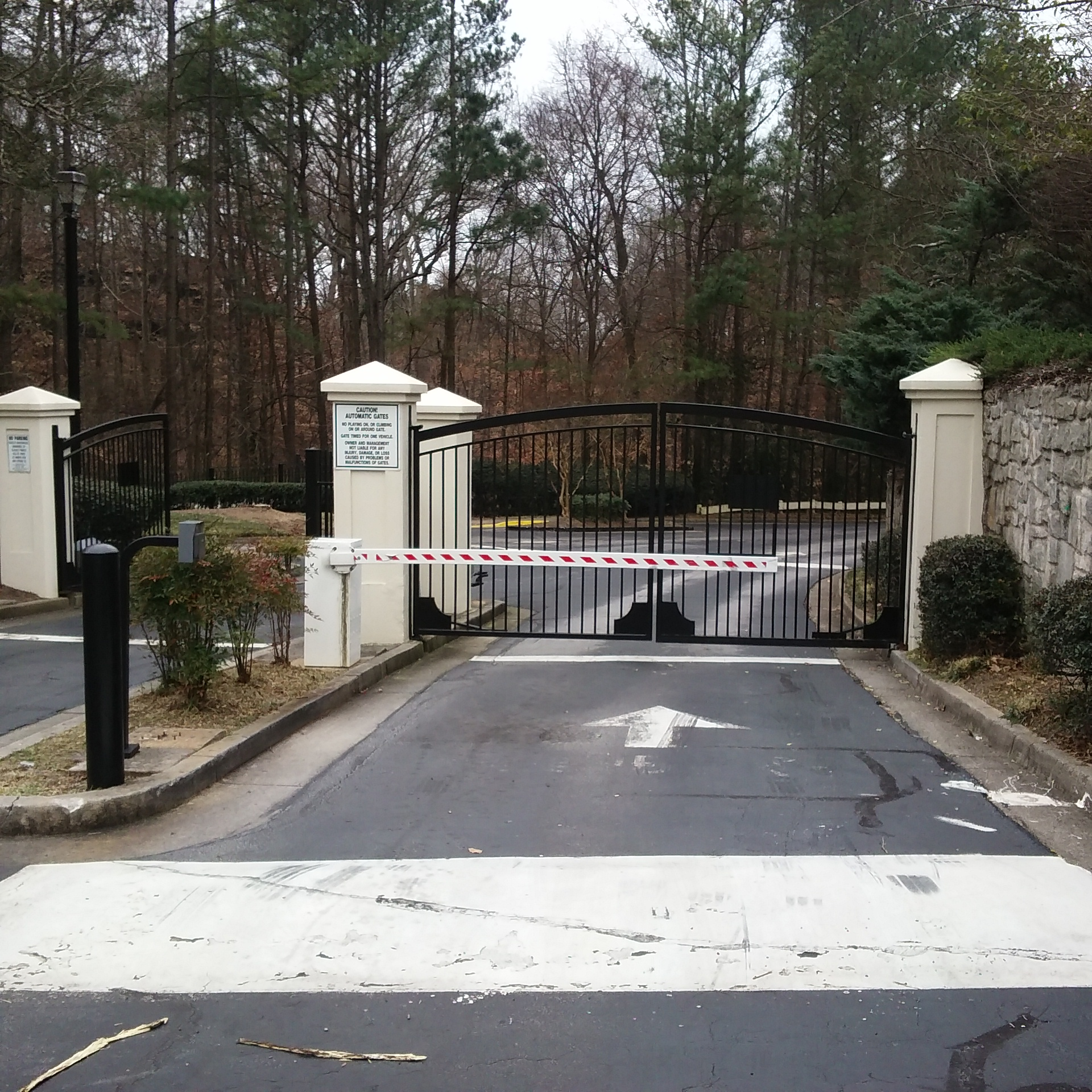 Standard suburban apartment complex gated entrance