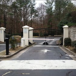Standard suburban apartment complex gated entrance Standard suburban apartment complex gated entrance