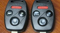 Photo 1. Photo-1: Two nearly identical Honda Pilot IRKs. The key on the left releases the rear glass in the hatch, while the key on the right operates the power opening and closing of the entire hatch.