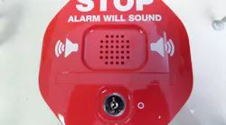 Signage warns 'Stop. Alarm will sound.'