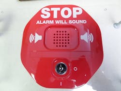 Signage warns 'Stop. Alarm will sound.' Signage warns 'Stop. Alarm will sound.'