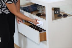 Opening drawer below retail display with card