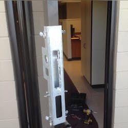 Jeff Fisher, a locksmith with Advanced Doors and Security of Denver, uses a jig and a high-speed router to prepare the edge of a narrow-stile glass aluminum door for a new mortise lock. Jeff Fisher, a locksmith with Advanced Doors and Security of Denver, uses a jig and a high-speed router to prepare the edge of a narrow-stile glass aluminum door for a new mortise lock.