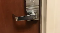 This fire-rated door installed in a hospital setting comes equipped with hardware that maintains its fire rating.