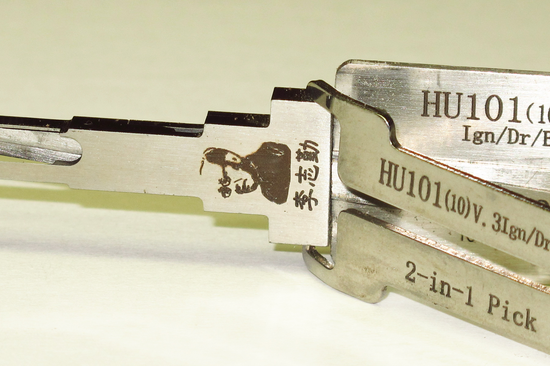 A genuine Lishi pick, with the proper engraving