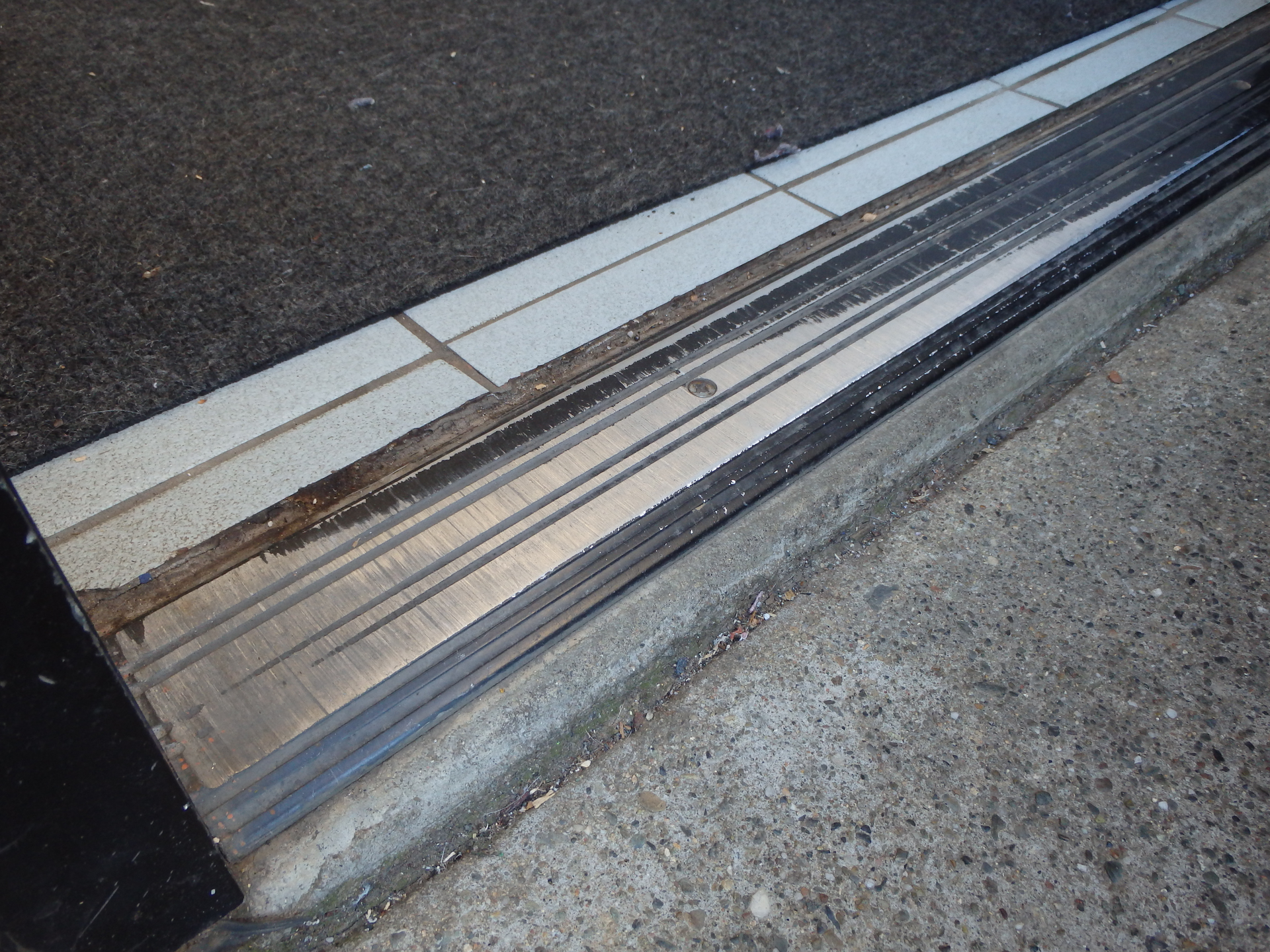 Damage caused by a sagging door.