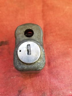 Image 3: The Corvette spare-tire lock removed from the assembly Image 3: The Corvette spare-tire lock removed from the assembly