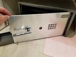 Image 2: This First Alert safe opened by using the technique known as safe bouncing. Image 2: This First Alert safe opened by using the technique known as safe bouncing.