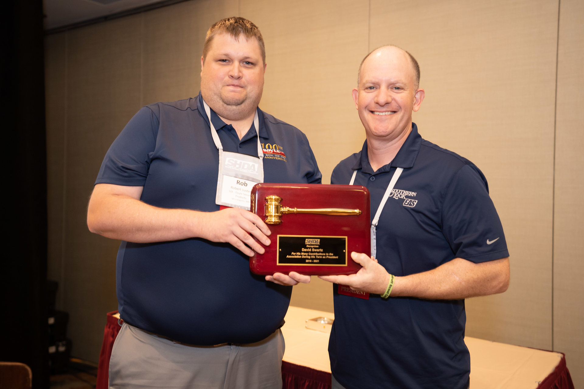 New SHDA President Rob Justen, left, presents outgoing President Dave Swartz with an award to commemorate his service.