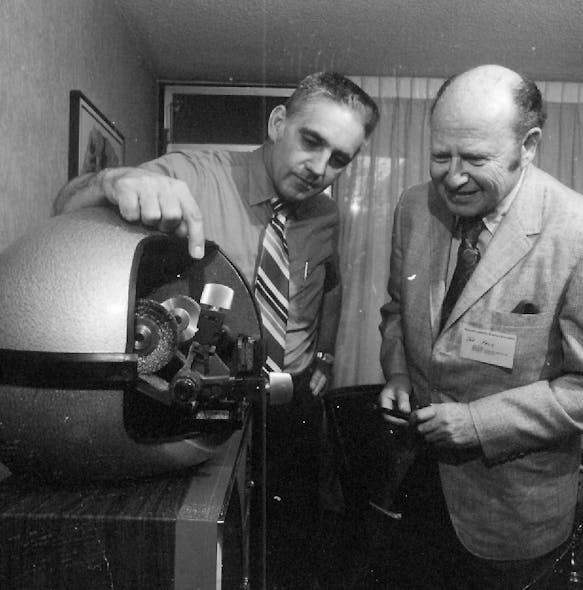 Don Wright, left, shows Joe Falk, original owner of Hardware Sales and Supply, now known as IDN Hardware Sales, a key machine in 1970.