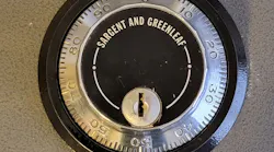 Image 1: The Sargent & Greenleaf three-wheel safe lock to be removed