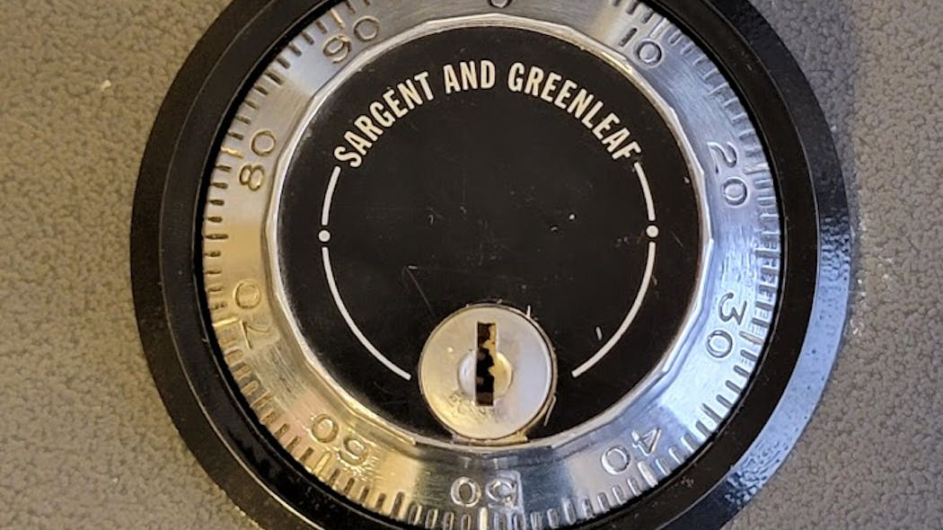 Image 1: The Sargent &amp; Greenleaf three-wheel safe lock to be removed