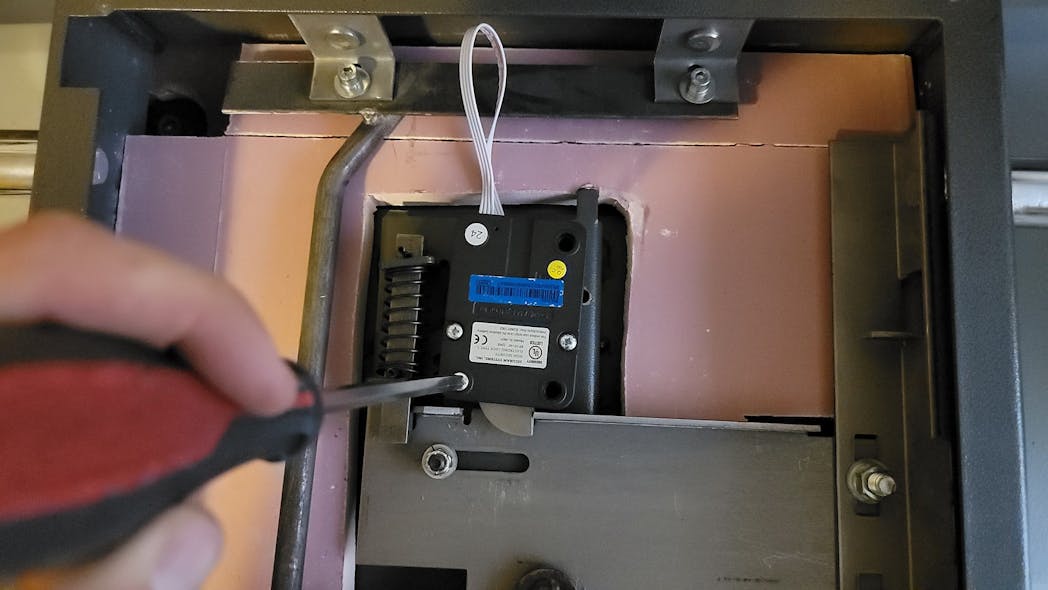Images 13 and 14: Make sure the lock wire is centered in the wire channel and not pinched or crushed, and a small gap is between the lock bolt and bolt work of the safe.