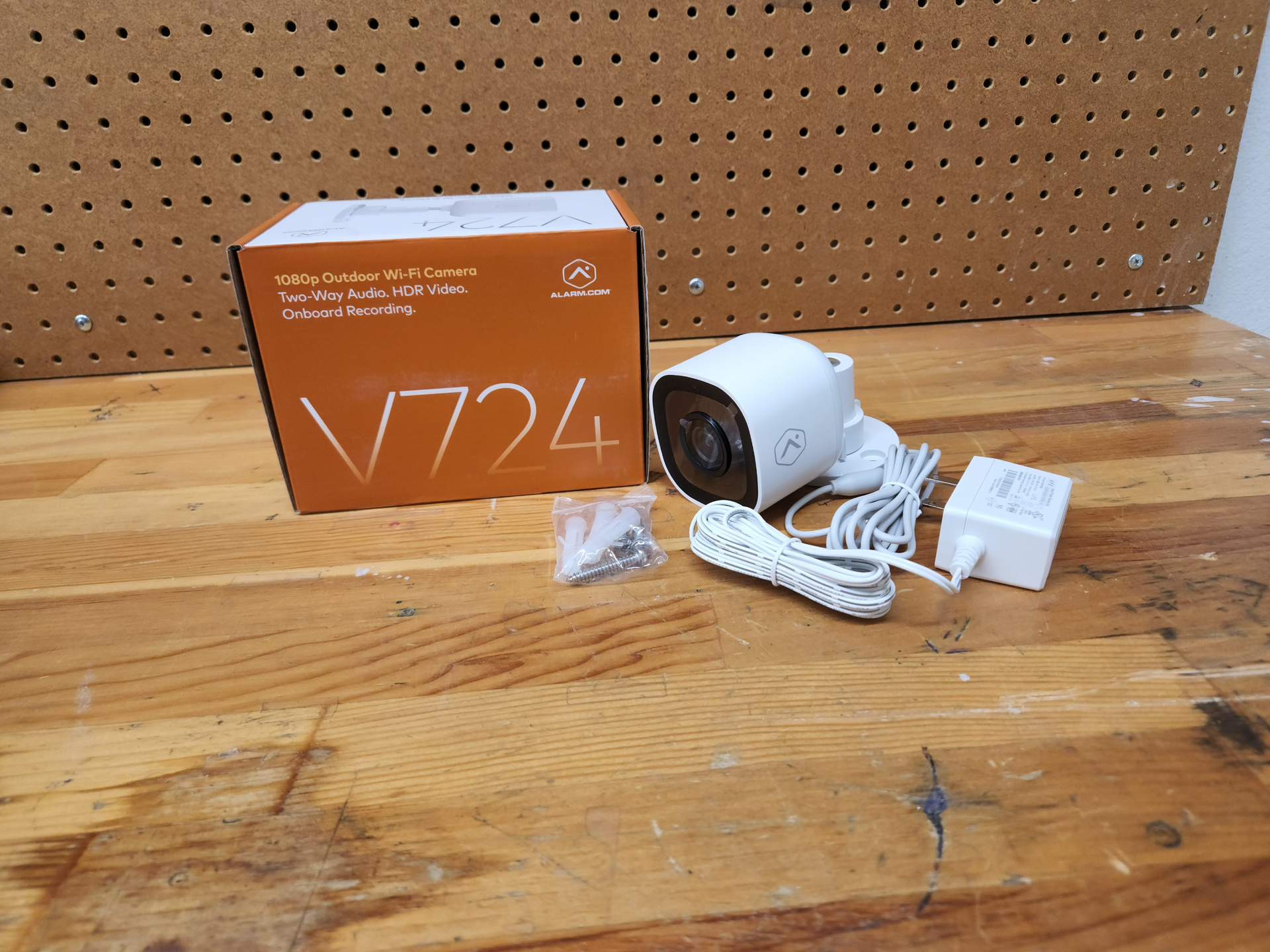 Image 1: The Alarm.com V724 unboxed and ready to be installed