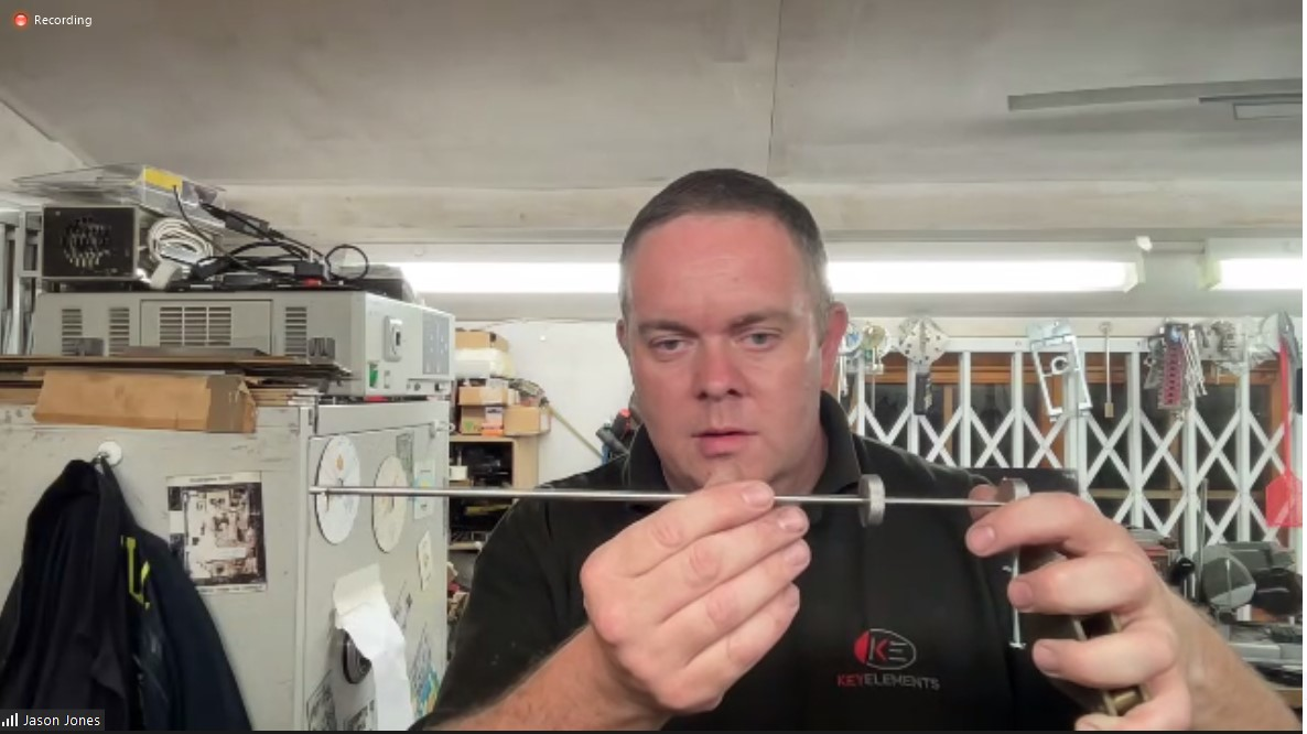 Jason Jones displays one of his lever-lock picks. He applies tension via the lever on the right, while the dial controls the tapping.