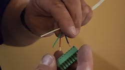 Image 13: Pulling out the terminal block makes it easy to install the wires. Image 13: Pulling out the terminal block makes it easy to install the wires.