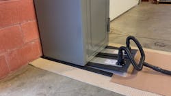 Inflated air lifts a safe onto the sleds. Inflated air lifts a safe onto the sleds.