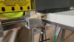 Photo 1. Bulls-I in action, drilling door for electronic access control installation Photo 1. Bulls-I in action, drilling door for electronic access control installation