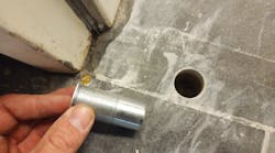 Photo 1. Installing a multi-point high security door receiver cup Photo 1. Installing a multi-point high security door receiver cup