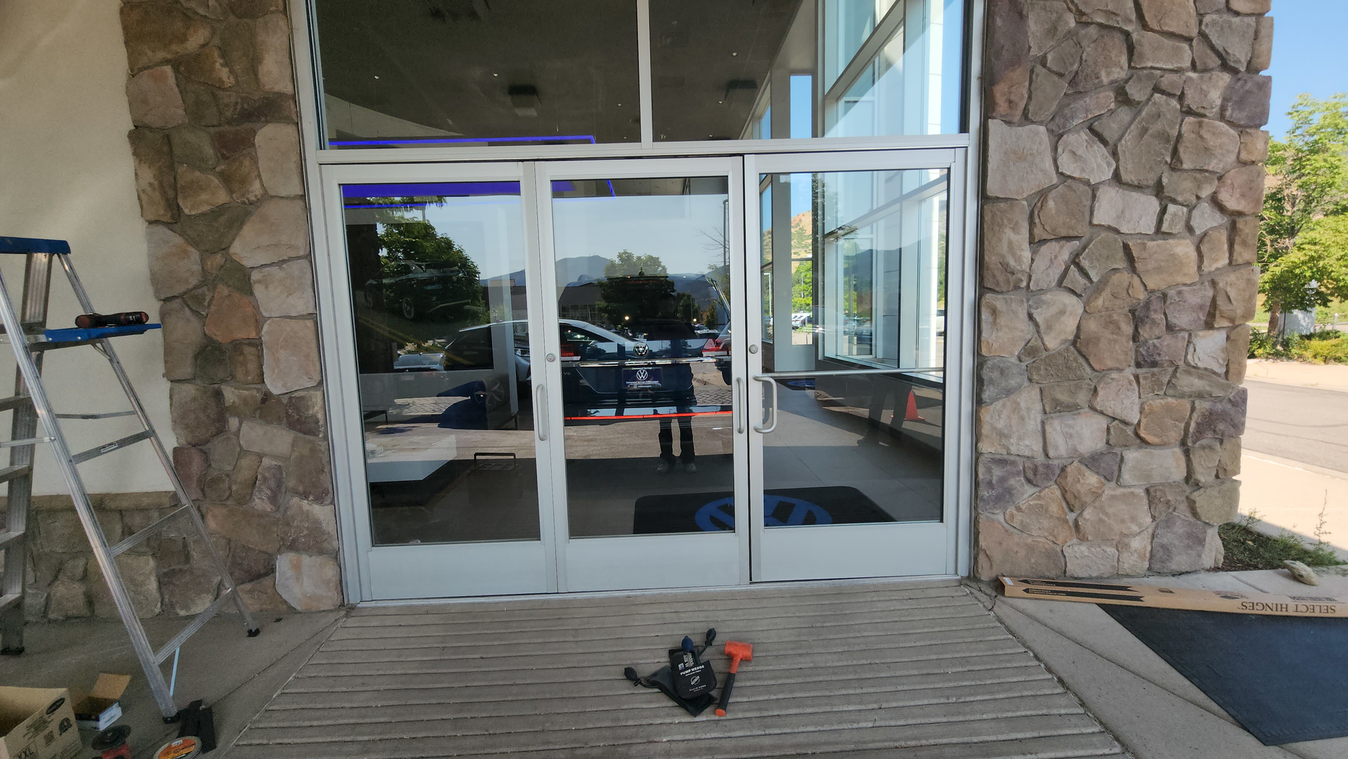 Photo 1. Car dealership showroom entrance.