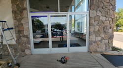 Photo 1. Car dealership showroom entrance.
