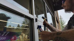 Photo 8. Using hammer to split old hinge in half Photo 8. Using hammer to split old hinge in half