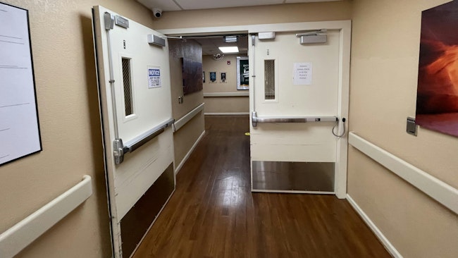 Typical hospital corridor opening. These high-traffic, high-abuse doors may be ripe for an upgrade.