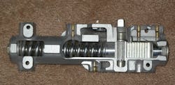Cutaway view, surface=mounted rack and pinion door closer Cutaway view, surface=mounted rack and pinion door closer
