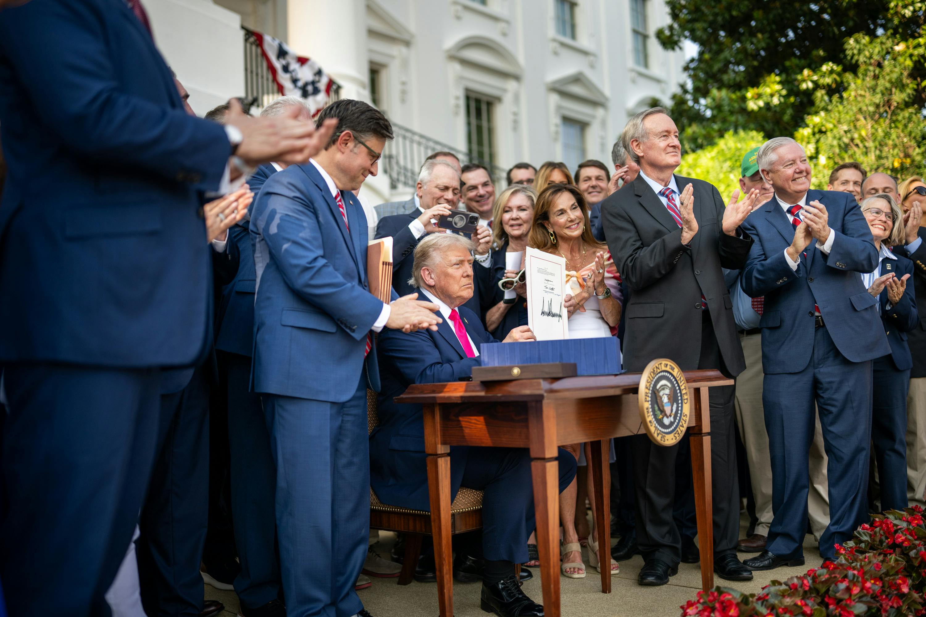 President Donald Trump signs the One Big Beautiful Bill Act on the South Lawn of the White House during a 4th of July picnic. (Official White House Photo by Daniel Torok)