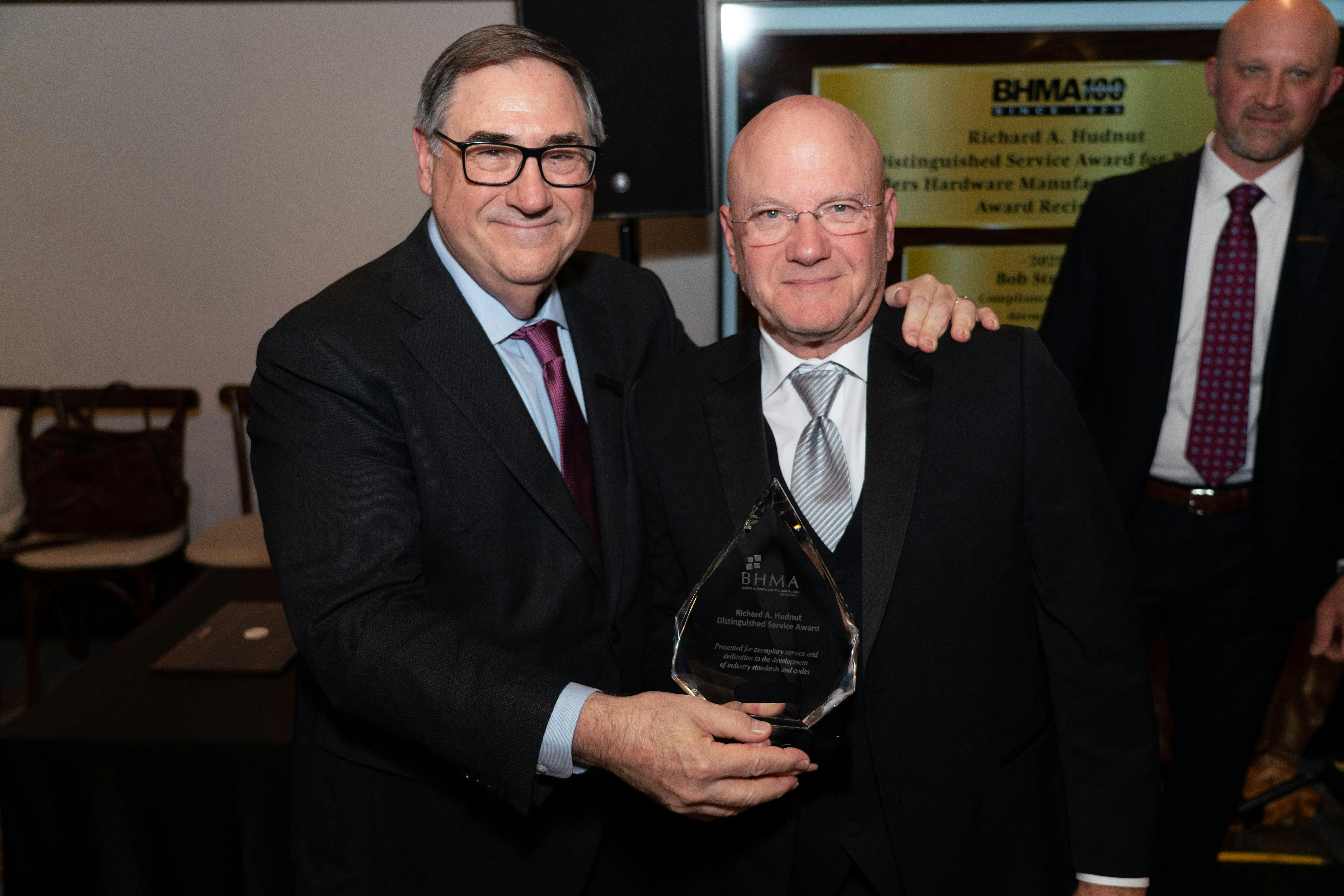 Robert Strong (right) accepts award from Ralph Vasami, BHMA Executive Director