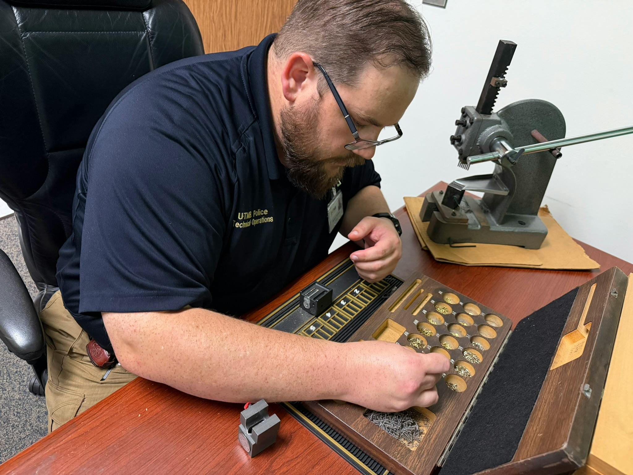 Pinning is one of the many responsibilities at the UTMB locksmith work area.