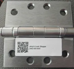 Photo 3. A Locksmith-branded QR label connects the physical opening to its information in Master Key Manager and keeps the servicing Locksmith’s identity in front of the customer.